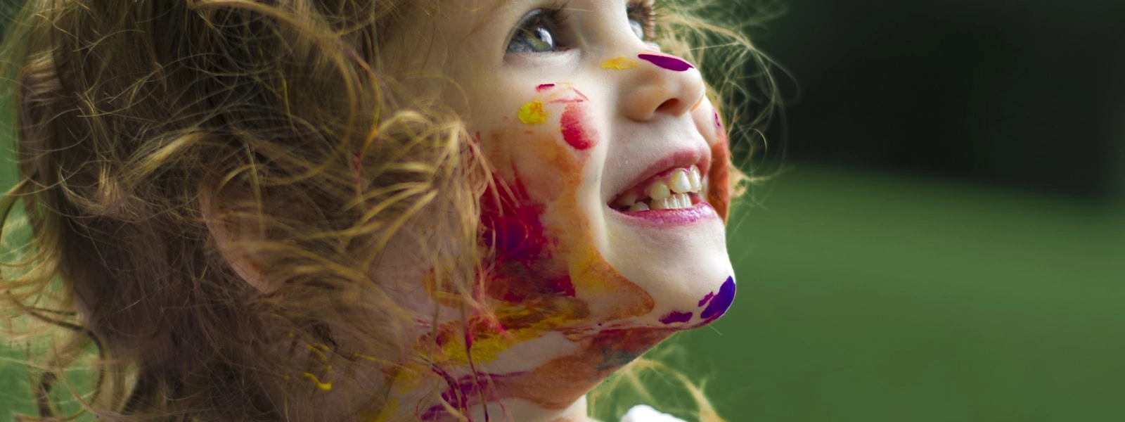 Child running in sunny field